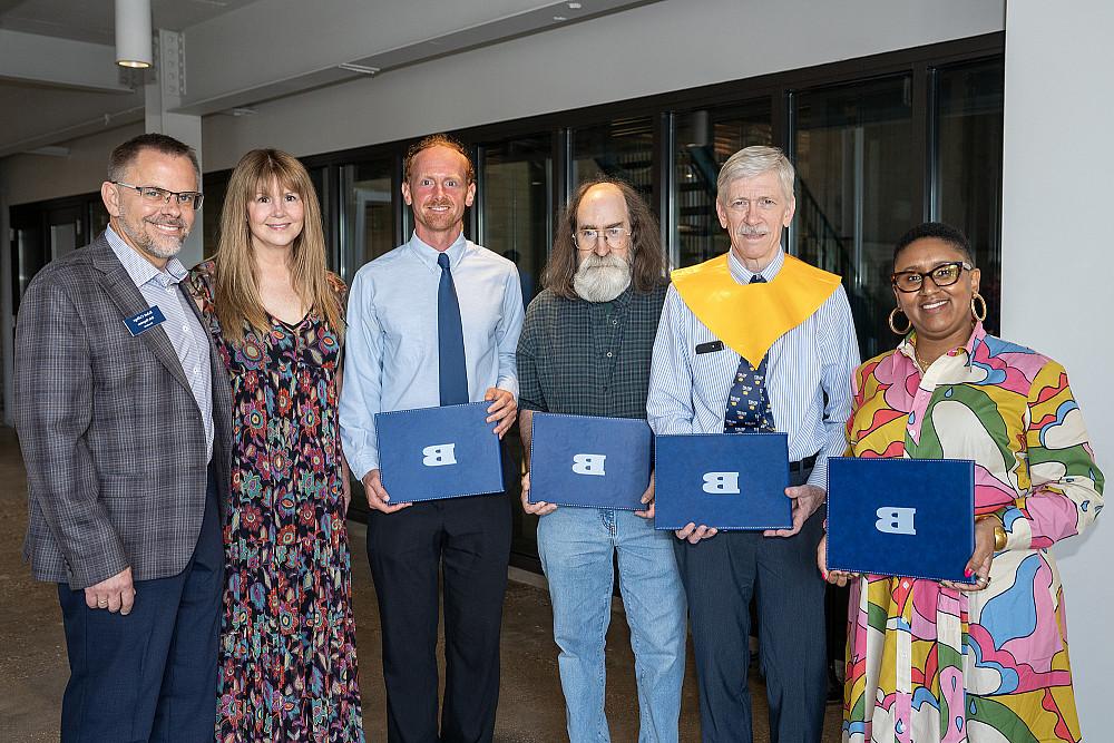 Recipients of 2024 Alumni Awards with President Eric Boynton and wife.